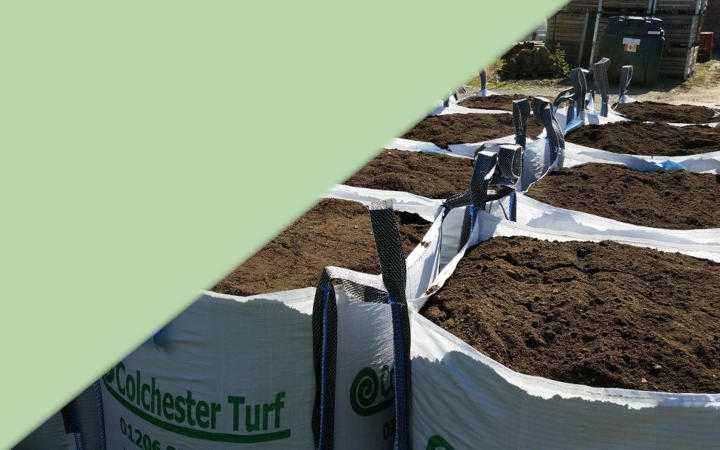 Bags of topsoil waiting to be delivered